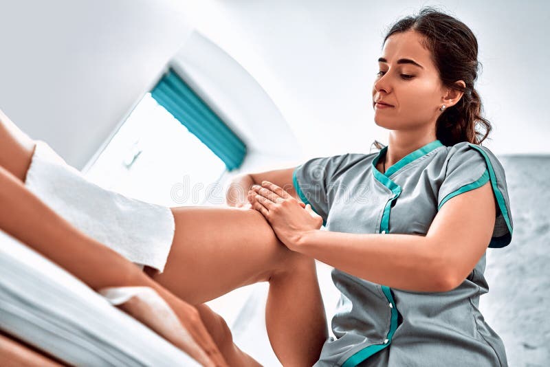 A Picture of a Physio Therapist Giving a Knee Massage Stock Photo