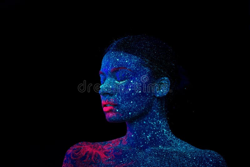 Picture of a pink jellyfish on the shoulder and face of the beautiful woman. ultraviolet body art. royalty free stock photos Picture of a pink jellyfish on the shoulder and face of the beautiful woman. ultraviolet body art. royalty free stock photos