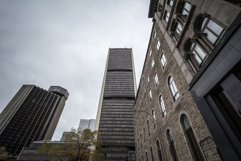 Vintage office skyscraper taken from a nearby street in the district of the Old Montreal, or Vieux Montreal, in the city of Montre