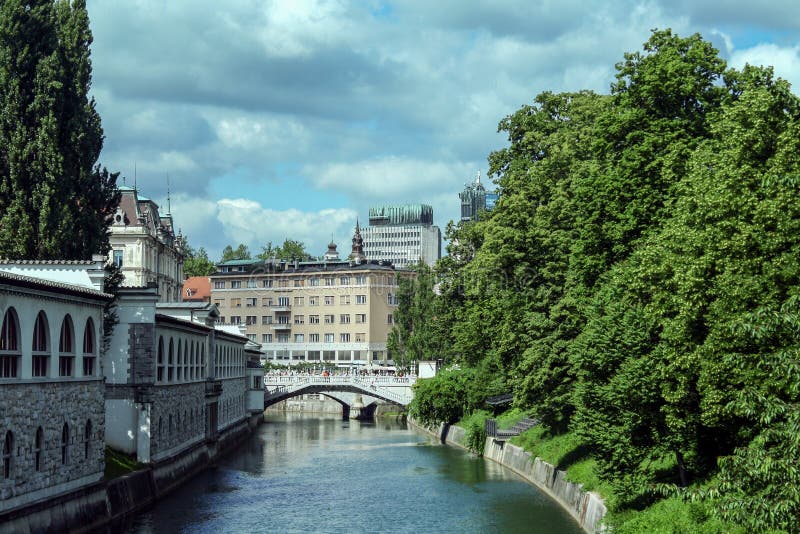 Tromostovje bridge Triple Bridge in Ljubljana Slovenia seen from apart. The bridge, over the Ljubljanica river. royalty free stock photos Tromostovje bridge Triple Bridge in Ljubljana Slovenia seen from apart. The bridge, over the Ljubljanica river. royalty free stock photos