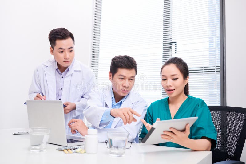 Picture of young team or group of doctors working stock images