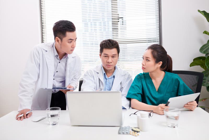 Picture of young team or group of doctors working stock photos