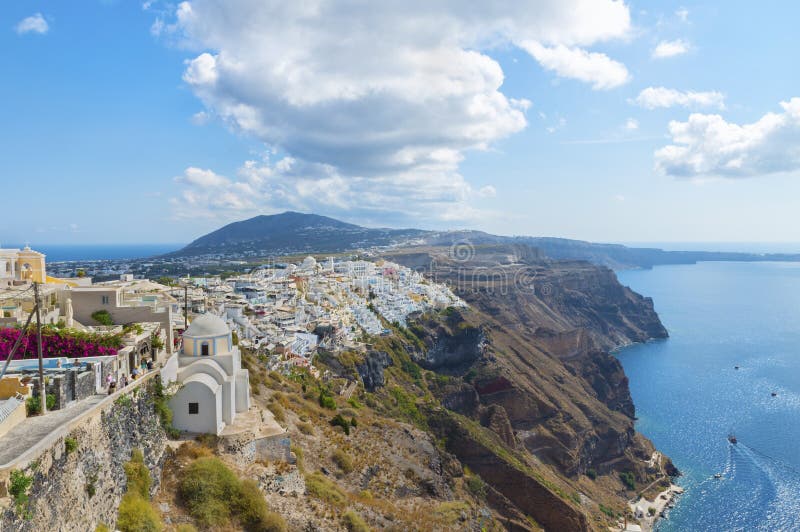 The picturesque aerial panoramic view from the height on the town of Fira and the surrounding area . Santorini island. stock photos The picturesque aerial panoramic view from the height on the town of Fira and the surrounding area . Santorini island. stock photos