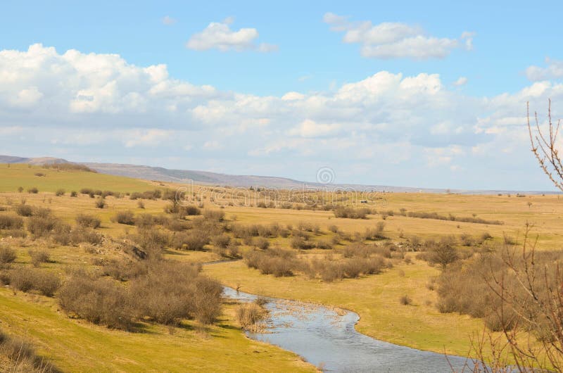 Picturesque autumn landscape of river and blue sky