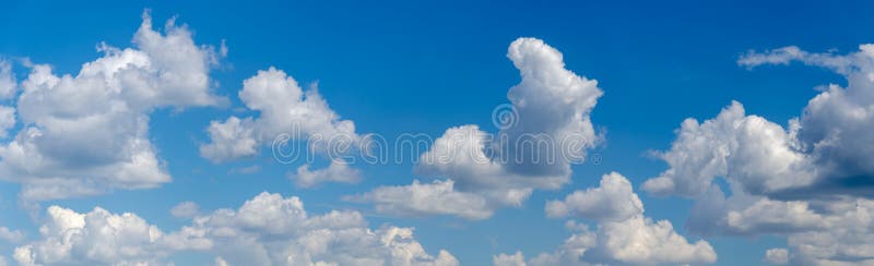 Panorama of blue sky with white cumulus clouds