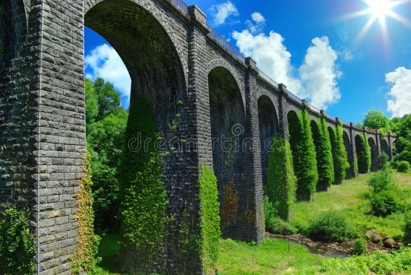 Picturesque landscape with ancient railway bridge. stock images