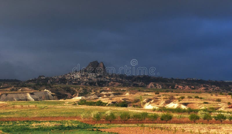 Picturesque landscape with a volcanic canyon in storm weather