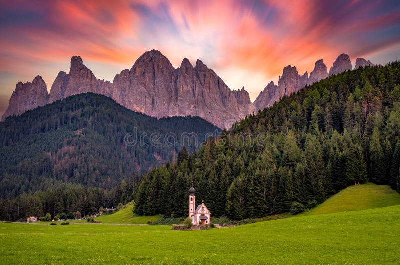 Picturesque natural view of the rocky mountains of Dolomites with the Dolomiti Funes Church