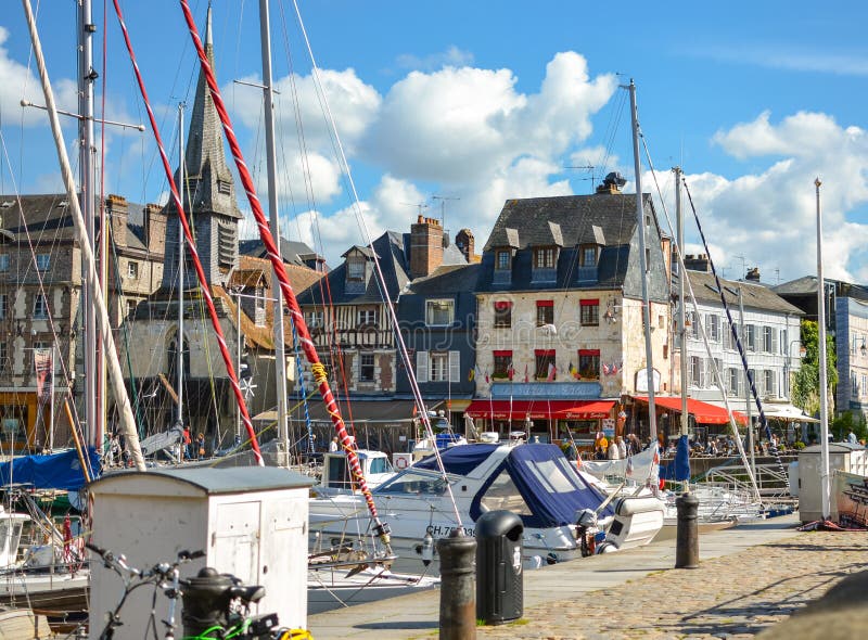 The picturesque old pier and harbor at Honfleur, France, on the Normandy Coast of the English Channel on a sunny afternoon royalty free stock image The picturesque old pier and harbor at Honfleur, France, on the Normandy Coast of the English Channel on a sunny afternoon royalty free stock image