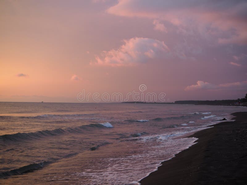 Picturesque Pink sunset on lake beach sea sand beautiful colors in the sky clouds
