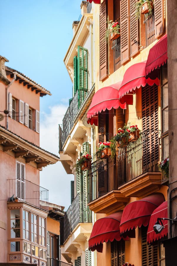 Picturesque row of houses with typical Spanish balconies near the market place in Palma de Mallorca, Spain royalty free stock image Picturesque row of houses with typical Spanish balconies near the market place in Palma de Mallorca, Spain royalty free stock image