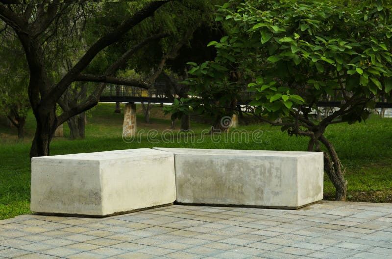 Picturesque View of Beautiful Park with Concrete Bench and Trees Stock