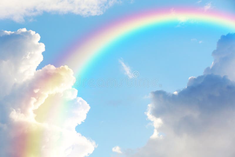 Picturesque view of beautiful rainbow and sky on sunny day