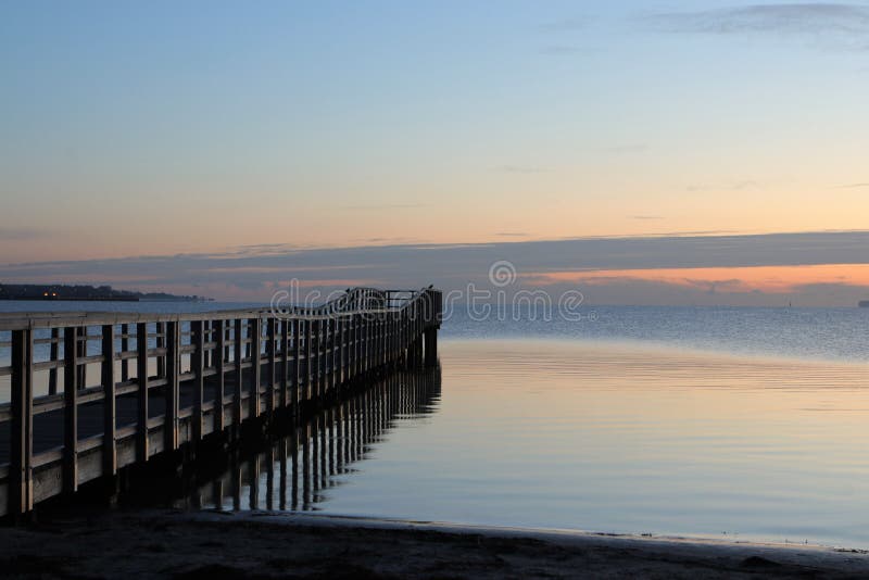 Picturesque wooden jetty at dawn