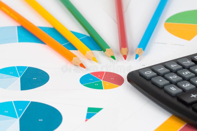 Pie and bar charts with pencils and calculator 3