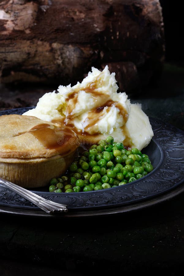 Steak Pie With Mash And Peas Stock Photo - Image of steak ...