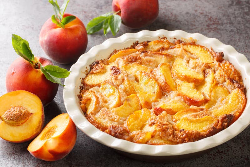 Oven baked perfect Southern dessert Peach Cobbler over concrete gray background. Horizontal. Oven baked perfect Southern dessert Peach Cobbler over concrete gray background. Horizontal