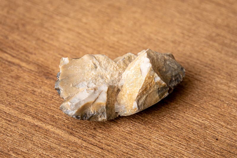 Piece of a flint stone, silex, used in prehistory as a tool. Stock Photo