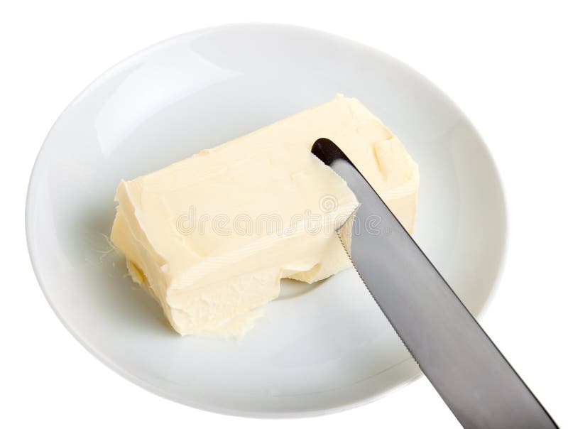 Piece of butter on a saucer and knife.