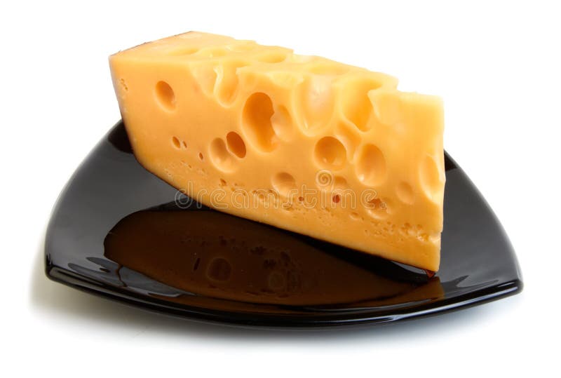 Piece of cheese on black plate