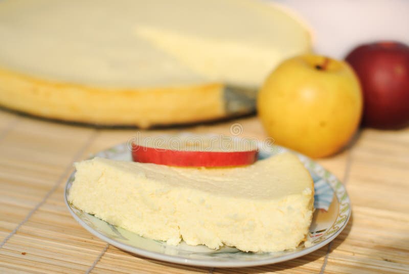 A piece of cheese cake with apples