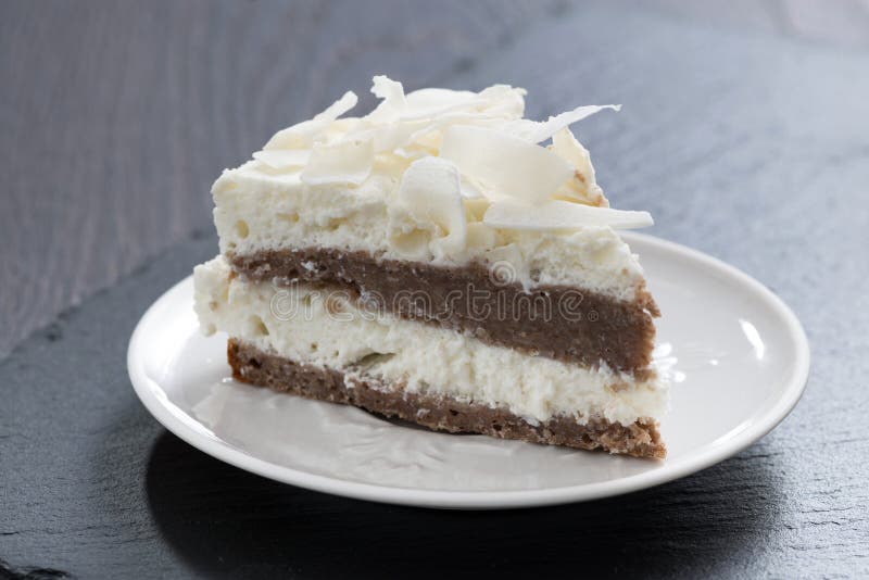 Piece of chocolate cake with coconut cream