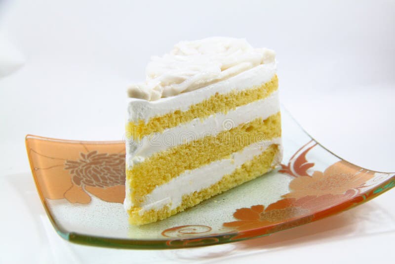 A piece of coconut cake on white background