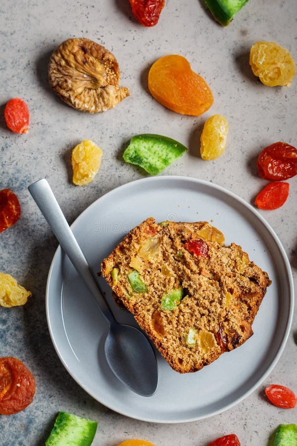 Piece of Dried Fruit Bread on a Gray Plate, Top View Stock Photo