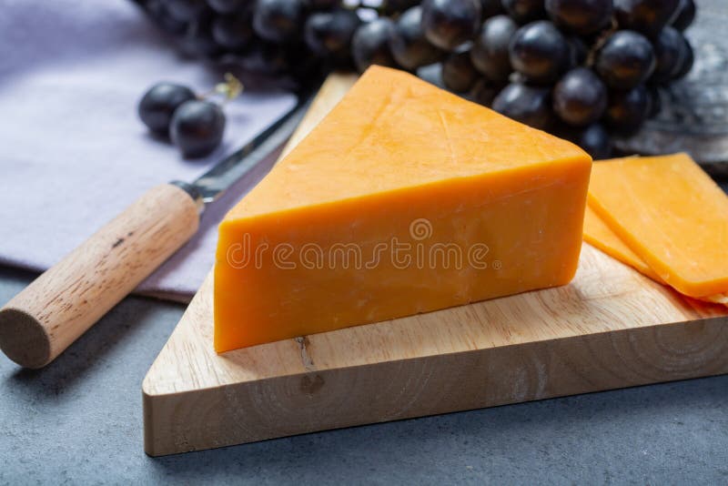 Piece of Hard Orange Cheddar Cheese Close Up Stock Photo Image of cheddar, black 139867356