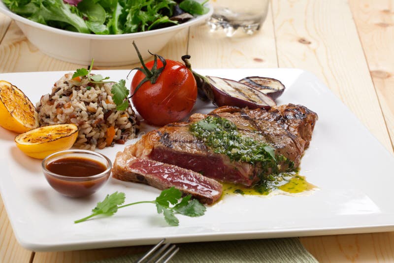 Piece of Medium Rare Steak with Spicy Herb Sauce Stock Image Image of