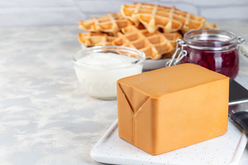 Piece of Norwegian Brown Cheese with Waffles, Lingon Jam and Cup of