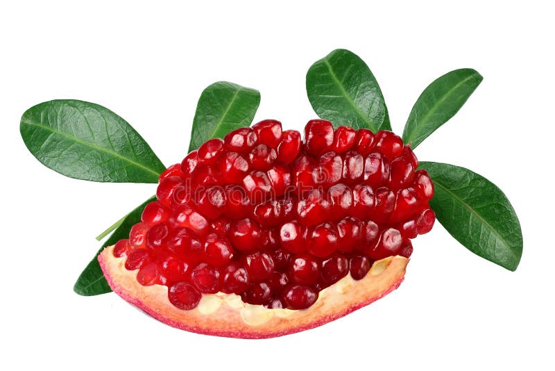 piece of pomegranate with seeds and green leaves isolated on a white background