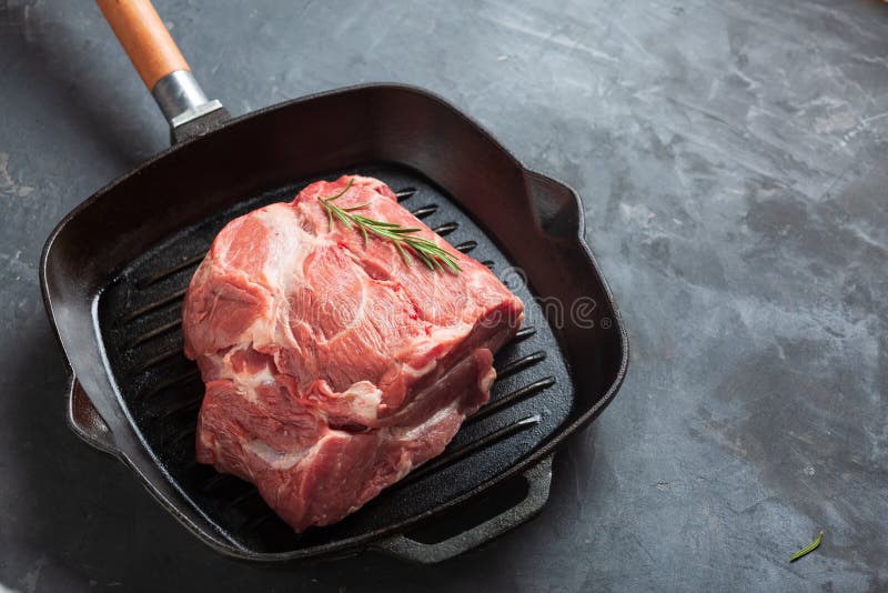 Raw Meat Cooking in Frying Pan on Stove Top Stock Photo - Image of