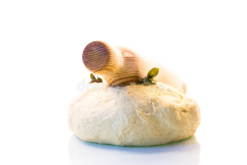 Piece of raw yeast dough with a sprig of mint isolated on a white background. Raw fresh yeast dough stock images, royalty-free photos and pictures