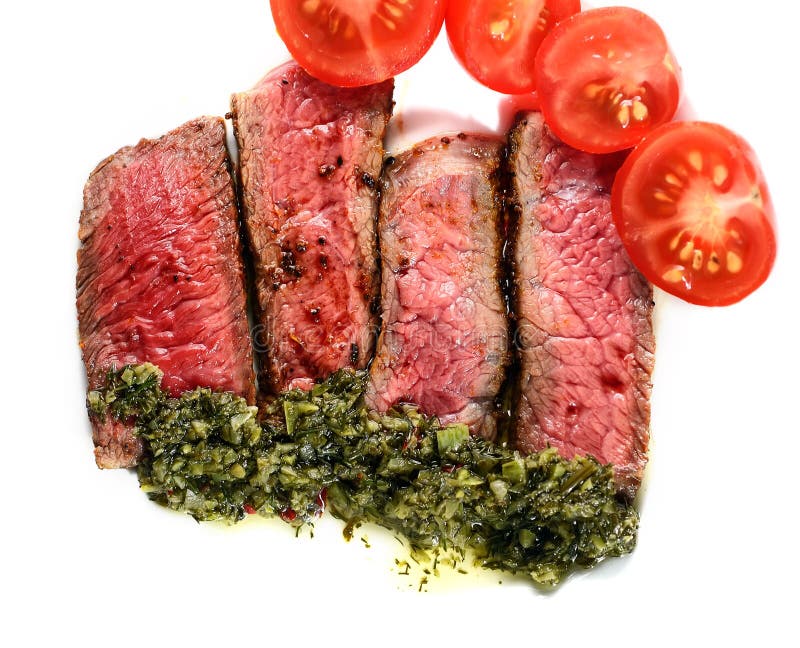 A Piece of Steak with Tomato and Green Sauce on a White Background