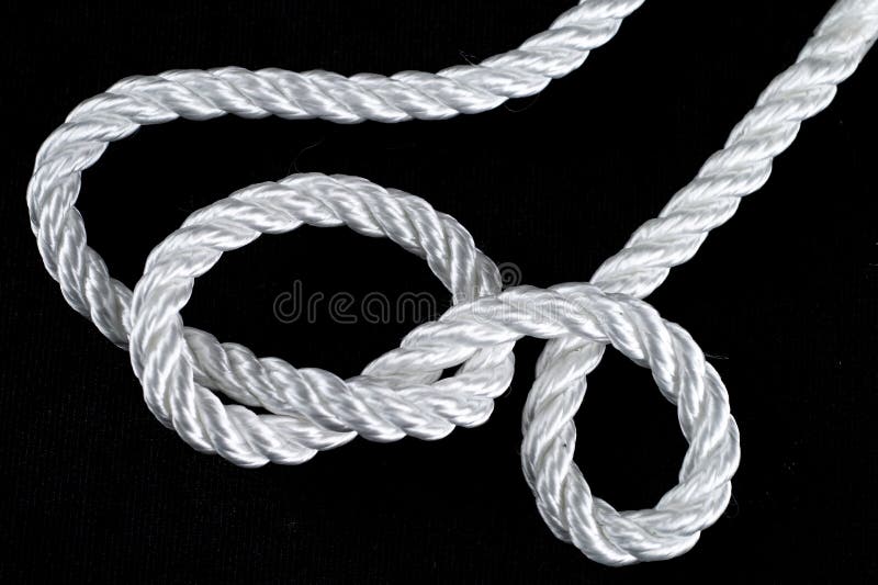 Rope knot isolated on a white background as a strong nautical marine line  tied together as a symbol for trust and faith and a metaphor for strength  or stress Stock Photo 