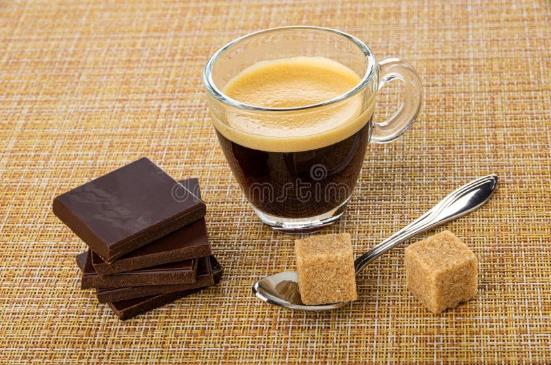 Pieces of Dark Chocolate, Cup with Coffee Espresso, Sugar Cube in Spoon
