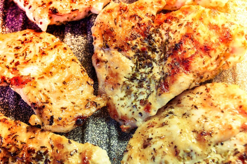 Pieces of Fried Chicken Breast. Grilled Poultry Steak Cooked on a Grill