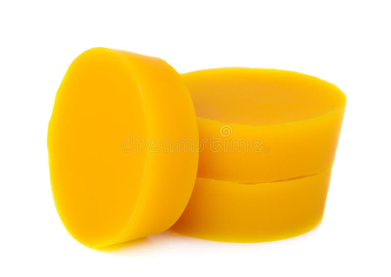 Pieces of natural beeswax are on a white background. Beekeeping products. Apitherapy. stock photo Pieces of natural beeswax are on a white background. Beekeeping products. Apitherapy. stock photo