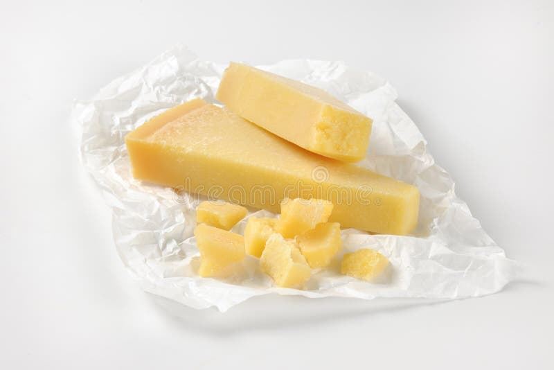 Pieces of parmesan cheese stock photo. Image of traditional 65704806