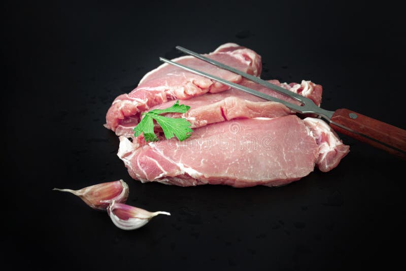 Pieces of Raw Roast Beef Meat with Ingredients, with Seasoning and