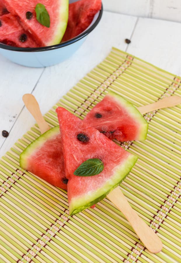 Pieces of Ripe Watermelon on a Stick on a White Background. Stock Image