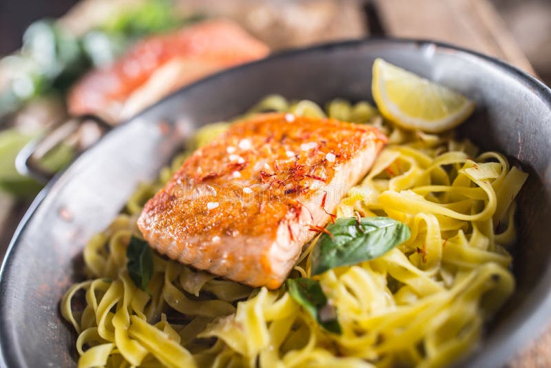Pieces of Roasted Salmon with Pasta Tagliatelle Lemon and Basil Stock ...