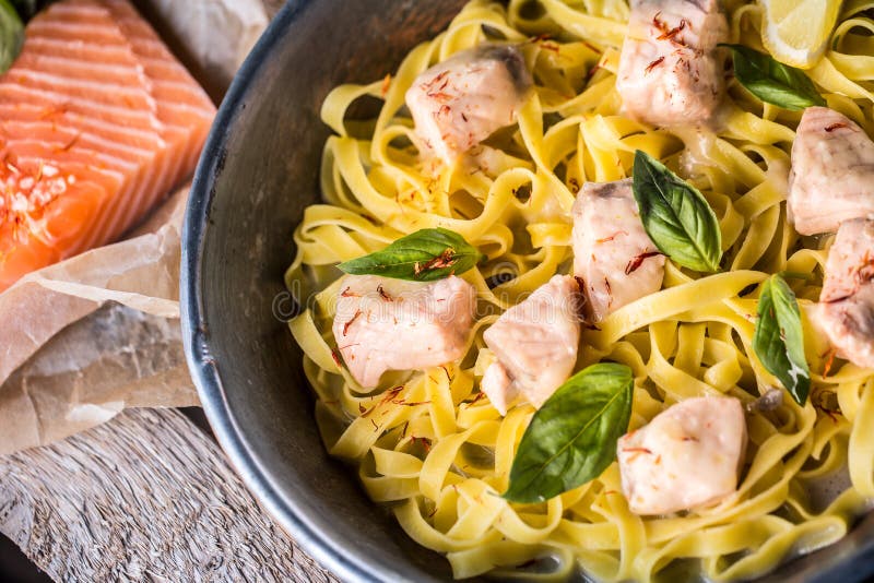 Pieces of Salmon with Pasta Tagliatelle Lemon and Basil Stock Image
