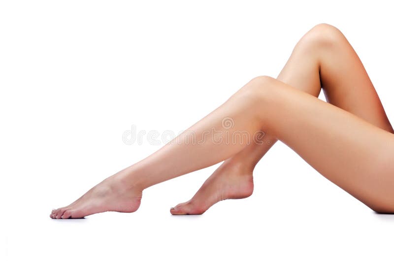 Piedini lunghi della donna su bianco immagine stock Piedini lunghi della donna su bianco immagine stock