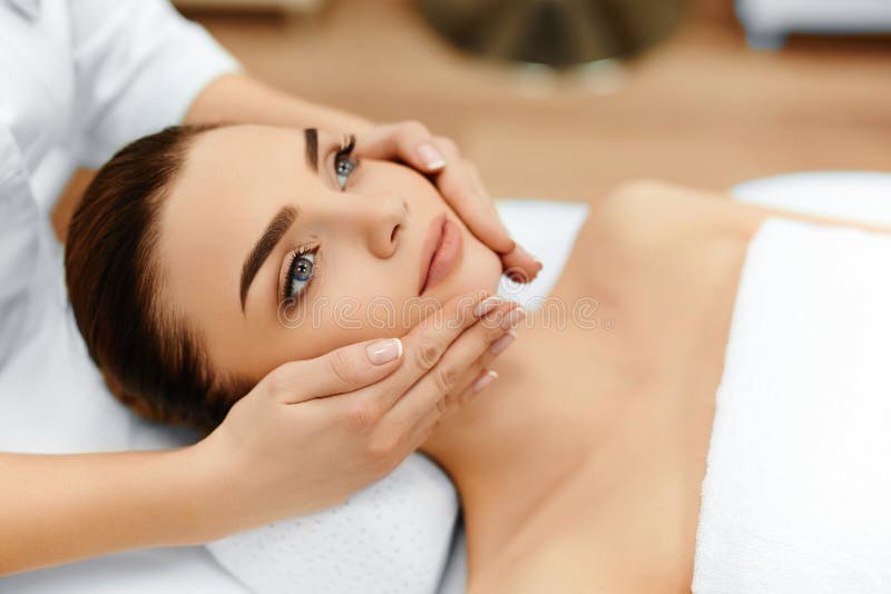 Skin And Body Care. Close-up Of A Young Woman Getting Spa Treatment At Beauty Salon. Spa Face Massage. Facial Beauty Treatment. Spa Salon. Skin And Body Care. Close-up Of A Young Woman Getting Spa Treatment At Beauty Salon. Spa Face Massage. Facial Beauty Treatment. Spa Salon.