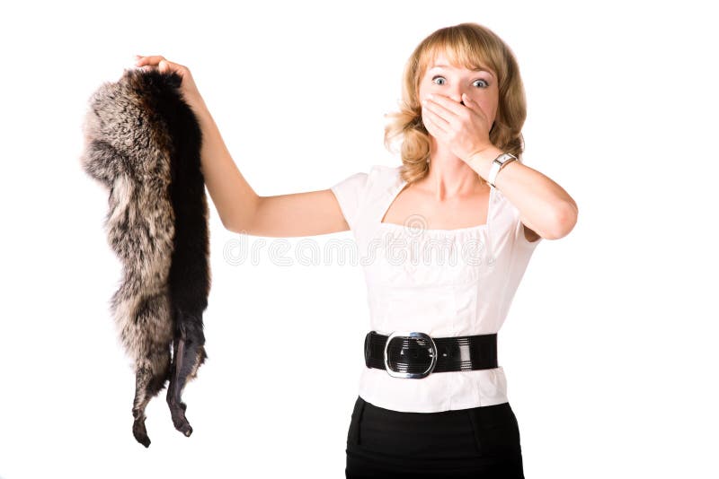 Shocked woman holding fur skin. Animal protection theme. Isolated on white. Shocked woman holding fur skin. Animal protection theme. Isolated on white.