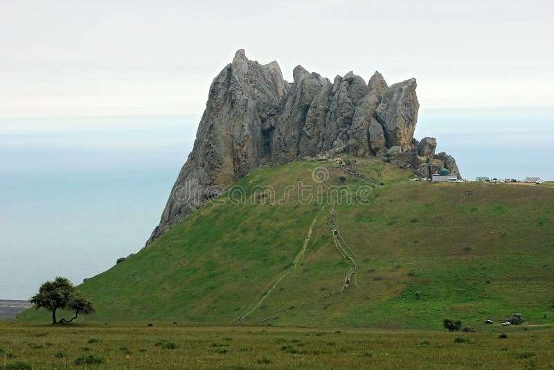 Baku. Azerbaijan. 05.08.2016. Pilgrims climb the sacred mountain Beshbarmag. Baku. Azerbaijan. 05.08.2016. Pilgrims climb the sacred mountain Beshbarmag