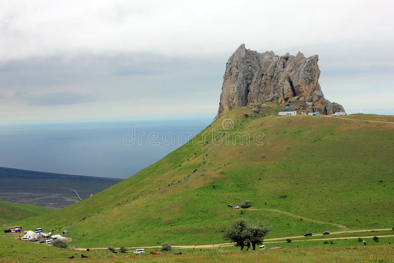 Baku. Azerbaijan. 05.08.2016. Pilgrims climb the sacred mountain Beshbarmag. Baku. Azerbaijan. 05.08.2016. Pilgrims climb the sacred mountain Beshbarmag