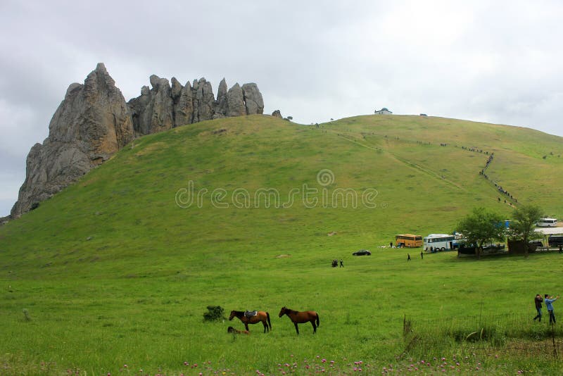 Baku. Azerbaijan. 05.08.2016. Pilgrims climb the sacred mountain Beshbarmag. Baku. Azerbaijan. 05.08.2016. Pilgrims climb the sacred mountain Beshbarmag